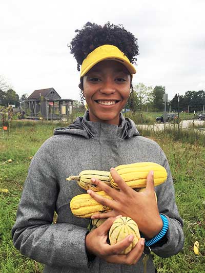 Campus-Farm-Woman-Holding-Squash