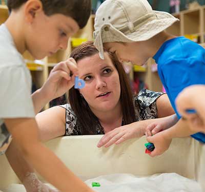 Student-Playing-With-Children