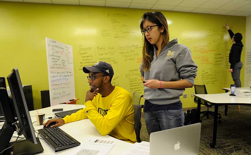 Students-at-a-Computer-and-Whiteboard